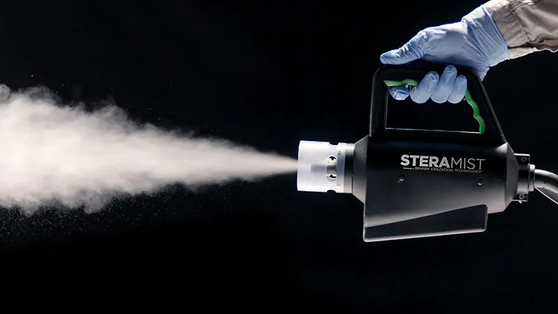 spray machine in hand spraying VHP